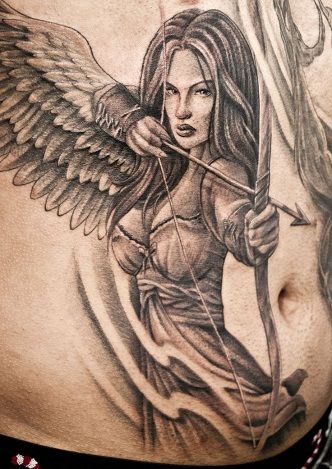 30 Best Warrior Tattoo Designs And Meanings With Pictures | Styles At Life Angel Girl Tattoo, Guardian Tattoo, Angel Warrior Tattoo, Archer Tattoo, Guardian Angel Tattoo Designs, Warrior Angel, Female Warrior Tattoo, Guardian Angel Tattoo, Valkyrie Tattoo