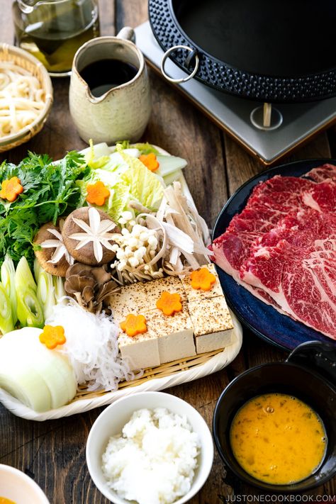 Cozy up at your next get-together with friends and family with this homemade Japanese Sukiyaki recipe. Served with seared marbled beef and a variety of vegetables cooked in a soy sauce broth, it makes a heart-warming meal to share at the table! #sukiyaki #hotpot #nabe | Easy Japanese Recipes at JustOneCookbook.com Japanese Sukiyaki Recipe, Japanese Sukiyaki, Sukiyaki Recipe, Japanese Hot Pot, Easy Japanese Recipes, Maitake Mushroom, Family Style Dinner, Japanese Recipes, Chinese Cabbage