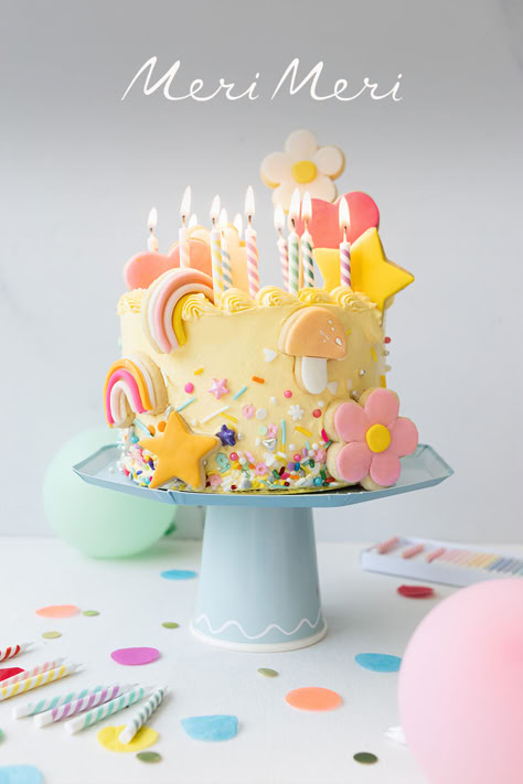 Colorful birthday cake decorated with flower, mushroom, heart and star sugar cookies and sprinkles. Cute Sugar Cookies, Pastel Baby Shower, Rainbow Birthday Cake, Balloon Cake, Baby Birthday Cakes, Meri Meri, Rainbow Sprinkles, Colorful Cakes, Rainbow Cake