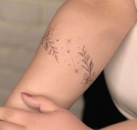 Vine Minimalist Tattoo, Celestial Bracelet Tattoo, Leaves And Stars Tattoo, Constellation Wrap Around Tattoo, Banded Tattoos For Women, Lower Arm Vine Tattoos For Women, Celestial Arm Band Tattoo, Minimalist Wrap Around Tattoo, Dainty Floral Wrap Around Tattoo