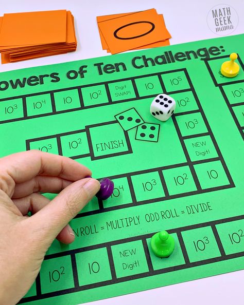 Help students understand what happens to numbers when we multiply and divide by powers of ten using this hands on math game. Students build numbers on their place value mat and then multiply and divide. They also practice seeing and using powers of ten written with exponents. Grab it free! Multiply & Divide by Powers of Ten Game: Includes Exponents Multiplying By Powers Of 10, Powers Of Ten Anchor Chart, Teaching Powers Of 10, Powers Of 10 Activities, Multiplying And Dividing By Powers Of 10, Place Value Mat, 5th Grade Math Games, Printable Math Games, Free Math Games