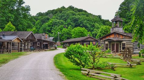 Visit the blacksmith shop, petting zoo, country store, and more at this old-fashioned village. Village In The Woods, Cabin Village, Bear Habitat, Restored Farmhouse, Huntington Wv, Take Me Home Country Roads, Living History Museum, Family Fun Night, Dnd Campaign