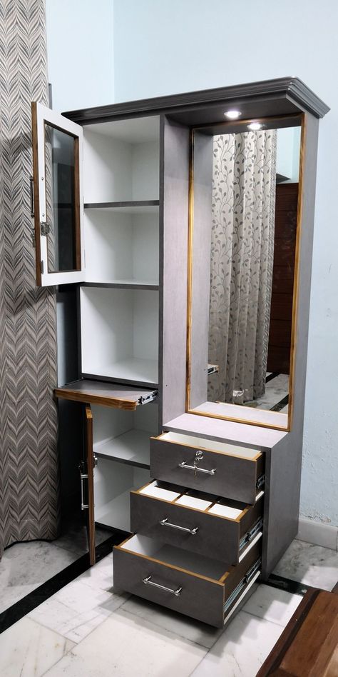 Discover stylish and space-efficient modern cupboard designs for small bedrooms. Elevate your space with innovative wardrobe interiors. Dressing Table Mirror Design, Modern Dressing Table Designs, Furniture Design Table, Wall Wardrobe Design, Unique Bedroom Design, Wooden Cupboard, Unique Bedroom, Modern Cupboard Design, Dressing Table Design