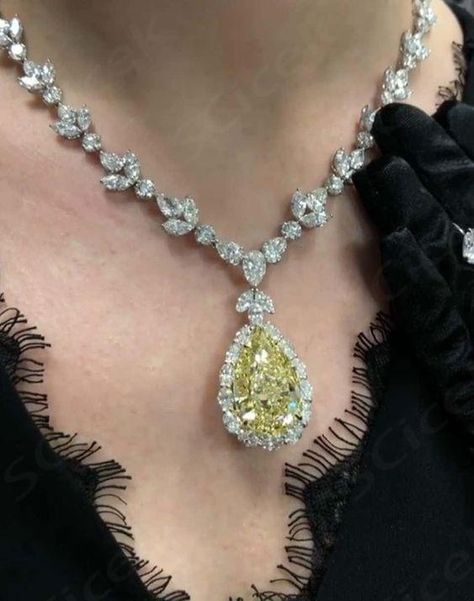 This absolutely stunning custom made necklace was created by Diana M. featuring 35.31 Carat Fancy Intense Yellow Pear Shape, one of the highest color grading, VS2 in Clarity. Surrounded by 47.00 carats of multi-shape diamonds, all D/E/F VVS/VS color and quality.  ... daha fazla Pear Diamond Necklace, Edgy Necklace, Yellow Diamond Necklace, Neck Pieces Jewelry, Kay Jewelry, Concert Fashion, Yellow Jewelry, Fancy Yellow Diamond, Luxury Necklace