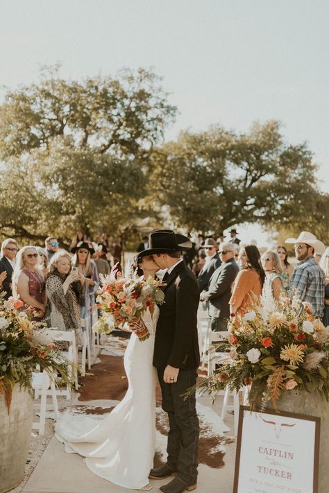 The picturesque setting of Sparrow Creek Ranch created a magical atmosphere for Caitlin and Tucker's wedding. 🌳The Grove 🌳is our primary outdoor ceremony space with big sprawling live oaks and stunning rolling hills behind it for a unique sense of depth that captures the ranch venue aesthetic! Captured by @miadsonrose.photo 📸a loved SCR Recommended Photographer! Planning by @designed2perfection Glam @prettyonpremises ✨ Sparrow Creek Ranch in 🔸September 🔸 Ranch Wedding Photos, Spring Wedding Western, Spring Western Wedding, Ranch Wedding Ideas, Venue Aesthetic, Country Wedding Ceremony, September Wedding Colors, Wedding Theme Color Schemes, Wedding Desert