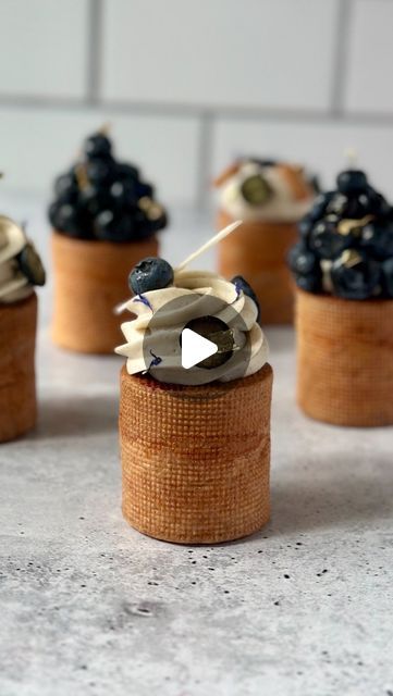 Fred Csibi-Levin | Doc Macaron on Instagram: "(Recipe) Blueberry Cardamom Choux Cylinders - These cylinder-shaped puffs are filled with a smooth blueberry cardamom mousseline (recipe below) and a bright blueberry confit. They were decorated with cardamom whipped ganache and fresh blueberries. Do you like perfectly shaped choux?  BLUEBERRY CARDAMOM MOUSSELINE (crème légère) 160g milk 80g blueberry purée 1tosp ground cardamom 50g sugar, divided in 2 15g cornstarch 2 egg yolks 25g butter, soft 120g heavy cream, 36-40%  THE PROCEDURE IN THE COMMENTS  #pateachoux #choux #chouxpastry #chouxpuff #blueberry #myrtille #pastry #patissier #patisserie" Blueberry Confit, Blueberry Cardamom, Choux Puff, Eclair Recipe, Whipped Ganache, Fine Dining Recipes, Choux Pastry, Egg Yolks, Cylinder Shape