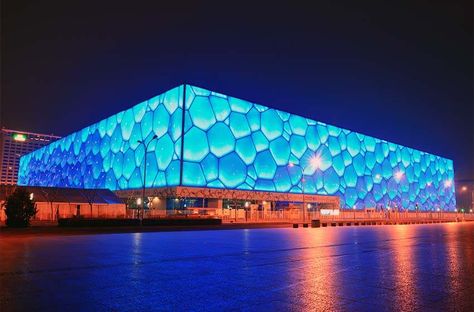 The Beijing National Aquatics Center is situated in Beijing, China. It was built alongside the Beijing National Stadium and is officially called the National Aquatics Center. It is also known as the "Water Cube". The groundbreaking ceremony was conducted on 24th December 2003. The architects who constructed this arena are PTW Architects, CSCEC, CCDI, and Arup. An estimated amount of $140 million was spent on the construction of the Beijing National Aquatics Center. Foster Architecture, Beijing National Stadium, Aquatics Center, Beijing Travel, Learn A Language, Stadium Design, National Stadium, Beijing China, Incredible Places