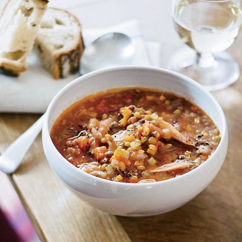 In Eugenia Bone’s smoked turkey soup recipe, she pairs green lentils, the popular legume that's a powerful plant-based protein source with a hearty texture, and smoked turkey meat for a rich and savory bowl. Simmering the broth with a Parmesan rind gives this smoked turkey soup a rich taste. Soup With Smoked Turkey, Smoked Turkey Soup, Turkey Lentil Soup, Smoked Turkey Wings, Turkey Soup Recipe, Smoked Turkey Recipes, Winter Soup Recipe, Canning Whole Tomatoes, Small Red Potatoes