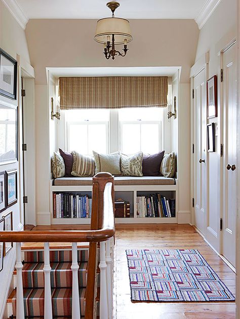 A cozy built-in bench makes for a perfect reading nook. See the rest of this coastal cottage: http://www.bhg.com/home-improvement/remodeling/before-and-after/a-coastal-cottage-renovation/?socsrc=bhgpin060213builtinnook=9 Library Seating, Built In Window Seat, Landing Ideas, Upstairs Landing, Window Seat Design, Window Nook, Cottage Renovation, Coastal Living Rooms, In The Corner