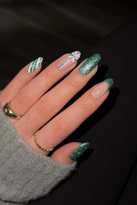 Green Glitter Christmas Nail Designs, Christmas Nails 2023 Almond Shape, Green Sparkly Nails Christmas, Green Christmas Nails Almond Shape, New Years Nail Designs Green, Green Almond Christmas Nails, Christmas Nails Green Glitter, Green Glitter Nail Art, Green Glitter Nails Christmas