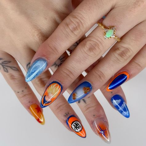 Dragonball Z nails on myself🤭 I asked Hayden what I should do for my nails this week and he said Dbz😂🐉🟠 so here we are. I’m so proud of these. Everything is hand painted (no stickers)!!! So excited to keep growing with my nail art and I can’t wait to be able to do sets like these for clients!! #dragonballznails #dragonballnails #dbznails #dragonballzart #animenails #animenailart #nailinspo #nailinspo2024 #clarksvillenails #clarksvillenailtech #nashvillenails #nashvillenailtech Charizard Nails, Dragonball Nails, Dragon Ball Nails Art, Goku Nails, Dbz Nails, Dragon Ball Nails, Pokemon Inspired Nails, Pokemon Nails, Paint Nail