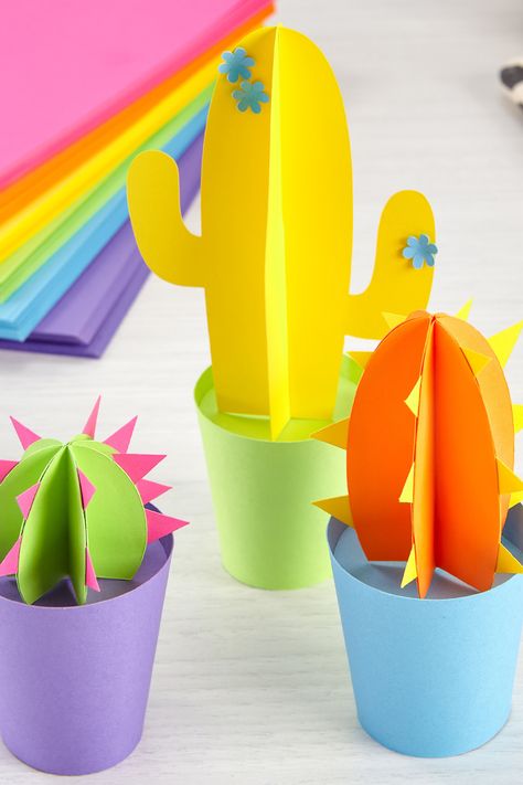 This colorful cactus craft will never desert you. These colorful DIY cactus plants are also perfect for birthdays, a kids craft session, school art classes, Cinco de Mayo, and more. To create, download the free template onto your favorite colors of Astrodesigns Cardstock. To make the pots, curl a medium piece of paper and glue the ends. Glue a circle shape towards the top so you can place your cacti. Voila. You’ve got a potted plant you don’t have to add water to! *Difficulty: Medium* Colorful Cactus, Paper Cactus, Diy Cactus, Cactus Craft, Paper Mobile, Home Workspace, Plant Crafts, Cactus Diy, Paper Plants