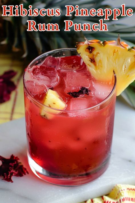 Hibiscus Pineapple Rum Punch is a refreshing and vibrant cocktail that combines the tartness of hibiscus tea with the sweetness of pineapple juice, balanced by the deep flavor of rum and a touch of grenadine for added sweetness and color. Pineapple Rum Punch, Summer Rum Cocktails, Dark Rum Cocktails, Rum Cocktails Easy, Hibiscus Cocktail, Cocktails To Make At Home, Rum Punch Recipes, Summer Drink Cocktails, Rum Cocktail Recipes