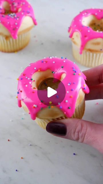 Coty Beth on Instagram: "Drippy iced donut cupcakes 🍩 I made the "donut" top with buttercream (freeze for ~15 manager placing cupcake on top), and dusted it with cocoa powder. Pink icing is ganache! #cupcakes #cupcakedecorating #donuts #cakehacks #cupcake" Donut Ideas For Birthday, Donut Cupcake Cake, Cupcake Donut Theme, Donut Themed Cupcakes, Donut Theme Cupcakes, Donut Cupcakes Ideas, Two Sweet Cupcakes, Ganache Cupcakes, Dozen Donuts