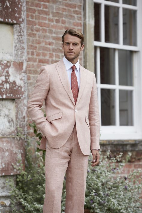 SS20 salmon pink two-piece linen suit with two slanted pockets available in-store at Favourbrook's 16-17 Pall Mall flagship boutique.  The perfect option for attending summer weddings as it's lightweight and the pastel hue can be easily worn with a variety of neutral tones in your shirt, tie and pocket square configuration. Salmon Pink Suit Men, Pastel Linen Suit Men, Blush Mens Suit, Pink Linen Suit Men, Blush Suits For Men, Salmon Suit Men, Linen Suit With Tie, Pastel Wedding Suit, Pastel Suits For Men