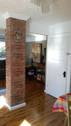 Exposed Chimney, Columns In Living Room, Chimney Ideas, Kitchen Brick, Columns Interior, House Upstairs, Foyer Wall, Kitchen Chimney, Interior Brick