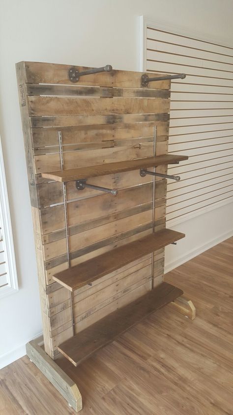 Retail Display Racks Pallet Wall Display Retail, Clothing Rack Store Display, Retail Display Wall Ideas, Retail Boho Store Displays, Diy Store Shelving Display, Retail Hanging Display Ideas, Boutique Clothing Displays Small Spaces, Pallet Retail Display, Rustic Clothing Display