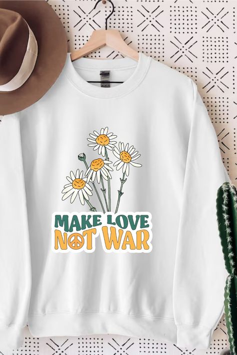 Discover our enthralling "Make Love Not War" Sweatshirt, which embodies peace, positivity, and bedroom romance. This fashionable clothing represents unity and harmony, making it a great gift for mothers. Its profound message praises mom and dad's unshakable bond, establishing a loving atmosphere for their children. This unique Design, is a statement of devotion to a better society, spreads love and understanding. Choose unity, love, and the "Make Love, Not War" Sweatshirt. #Positivity Mom Shirts Funny, Coffee Sweatshirt, Dog Mom Shirt, Autumn Coffee, Custom Sweatshirts, Pumpkin Spice Latte, Look Plus, Unique Outfits, Dog Shirt