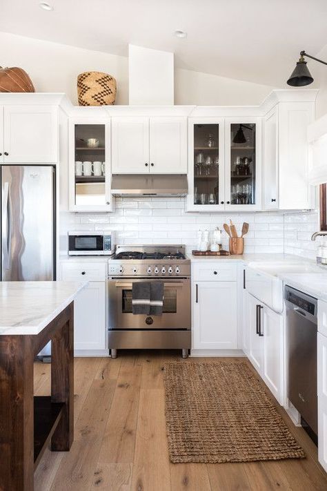 White and Wood Modern Farmhouse Kitchen with White Cabinets, Wood Island and Hardwood Floors #kitchen #kitchendecor #kitchendecorideas #kitchendecorating #kitchendecoratingideas #farmhousekitchen #modernfarmhousekitchen #whitekitchens #modernfarmhouse #farmhouse #farmhousedecor Kitchen Wood White, Tall Ceiling Kitchen, Farmhouse Kitchen With White Cabinets, Kitchen With White Cabinets, Closed Kitchen, Modern Farmhouse Kitchen, Wood Island, Farmhouse Kitchen Cabinets, Farmhouse Remodel