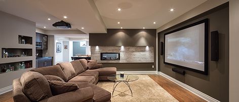 Design a home theatre with immersive sound but no wires in sight. All wires need to be at least 2.5 cm from any pipes or duct work, so talk to your Licensed Electrical Contractor about the electrical requirements to safely hide the wires before closing up the walls. Projector In Basement, Basement Home Theater, The Big Comfy Couch, Theater Furniture, Tv Area, Home Theater Furniture, Floor Lighting, Best Home Theater, Home Theater Setup