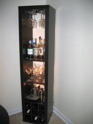 "I needed a bar unit to hold some stemware, liquor, and wine. While my new place has tons of vertical space (3 meter high ceilings), I didn't have a lot of floor space in my dining nook. Therefore, I decided a tall, vertical rack would be best. When I was unable to find one that suited me, I decided to make one out of a few parts from Ikea. Corner Bar Cabinet, Mini Loft, Corner Bar, Bar Unit, Condo Design, Ikea Kallax, Ikea Hackers, Diy Things, Diy Bar