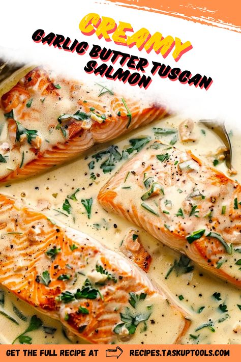 Indulge in the rich flavors of Creamy Garlic Butter Tuscan Salmon, a gourmet dish that brings the taste of Italy to your dinner table. This easy-to-follow recipe features tender salmon fillets smothered in a luscious garlic butter sauce, complemented by sun-dried tomatoes and fresh spinach. Perfect for a weeknight meal or special occasion, this dish offers a delightful fusion of creaminess and savory goodness. Elevate your cooking with this mouthwatering recipe that promises to impress family and friends alike Creamy Garlic Butter Tuscan Salmon, Smothered Salmon Recipe, Salmon With Creamy Spinach Sauce, Salmon And Ravioli Recipes, Tuscan Butter Salmon, Creamy Garlic Butter Salmon, Salmon Tuscan Recipe, Creamy Garlic Tuscan Salmon, Creamy Tuscan Salmon