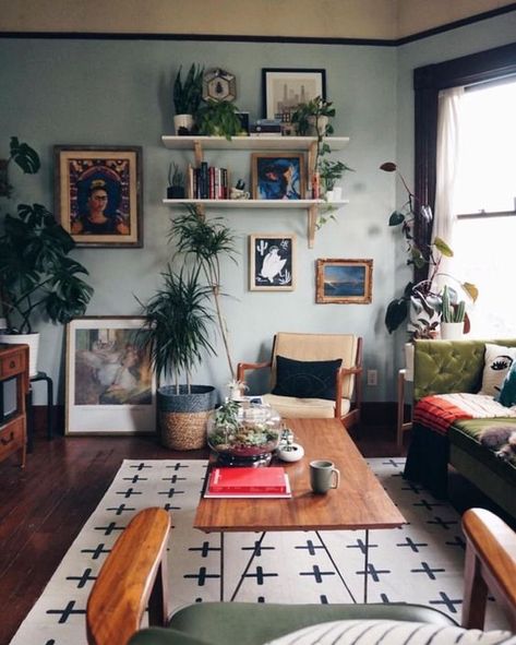 an eclectic living room with a gallery wall, open shelves, light blue walls, vintage furniture and potted greenery Rustic Bohemian Living Room, Bohemian Living Rooms, Design Salon, Eclectic Living Room, Bohemian Living Room, Rustic Living Room, Room Decorations, Living Room Inspo, A Living Room