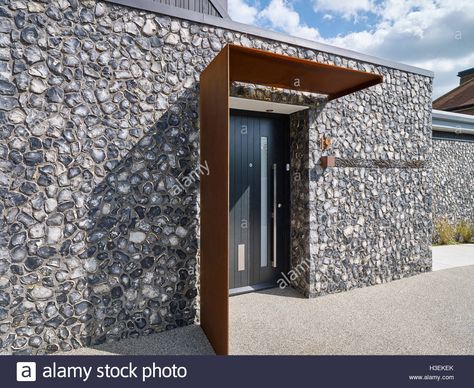 Download this stock image: Entrance to the house. Front elevation with flint and rusted corten steel. House 19, Old Amersham, United Kingdom. Architect: Jestico + Whiles, 2016. - H3EKEK from Alamy's library of millions of high resolution stock photos, illustrations and vectors. Ikea Canopy, Front Door Canopy, Canopy Bedroom, Backyard Canopy, Modern Entrance, Garden Canopy, Door Canopy, Door Awnings, Carseat Canopy