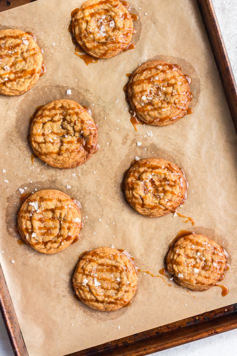 This Crispy Salted Caramel Cookies recipe combines homemade caramel with a perfect balance of salty and sweet flavors in these decadent cookies. Each bite boasts a crunchy exterior and a soft, chewy center, elevating this cookie to irresistible heights. Salty Caramel Cookies, Salted Caramel Cookies Recipe, Caramel Cookies Recipes, Salted Caramel Cookies, Crispy Cookies, Salted Caramel Sauce, Caramel Cookies, Homemade Caramel, Caramel Sauce