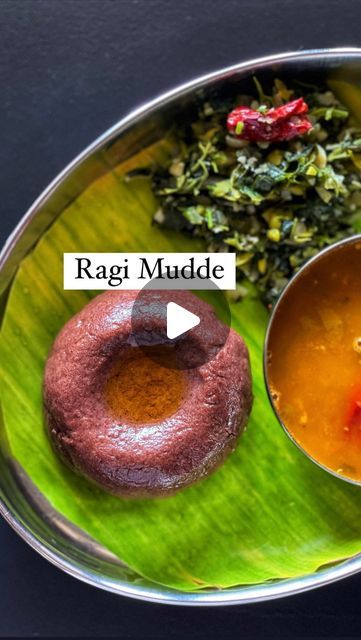 Vinny Shukla on Instagram: "Ragi Mudde.. soft and lump free! This is the longest video on my page looks like. I have tried my best to make the steps clear.  Just follow these steps..  Ragi flour - 1 cup Water - 2 cups  Remove 2 tsp flour from 1 cup and make a slurry with 1/4 cup of water.  Now heat the remaining water, simmer the flame and add the slurry.   Stir it on low flame until you see the colour change and thicken.  Add the remaining flour sprinkled evenly as shown in the video.  Leave it undisturbed in the simmer.  You’ll see water coming up all over. Tap down the dry flour and with a round bottom wooden spatula, mix it all well quickly without any lumps.  Sprinkle some water on top and cook it covered on lowest flame for 5 to 7 minutes.  When you open, you’ll see that the bottom o Ragi Mudde Recipe, Ragi Mudde, Ragi Flour, Wooden Spatula, Cup Of Water, 7 Minutes, 5 To 7, The Flame, Ghee