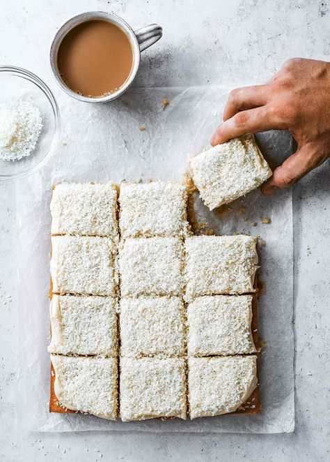 This coconut sheet cake, topped with tangy cream cheese frosting and a shower of coconut is the lightest and fluffiest we've ever tried. #cake #baking #coconut #sheetcake Coconut Sheet Cake, Edd Kimber, Coconut Sheet Cakes, Coconut Squares, Coffee Icing, Almond Ice Cream, Ginger Cake, Coconut Cake, Moist Cakes