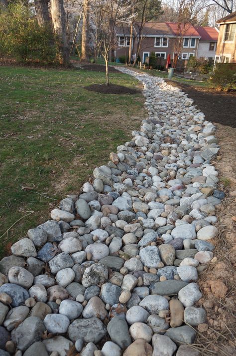 Rock Ditch Landscaping, Drainage With Rocks, Pebble Drainage, River Rock Water Drainage, Rock Drainage Ditch, Rock Bed Drainage, Culvert Landscaping Ideas Driveway, Rocks For Drainage Yards, Drainage Ditch Landscaping