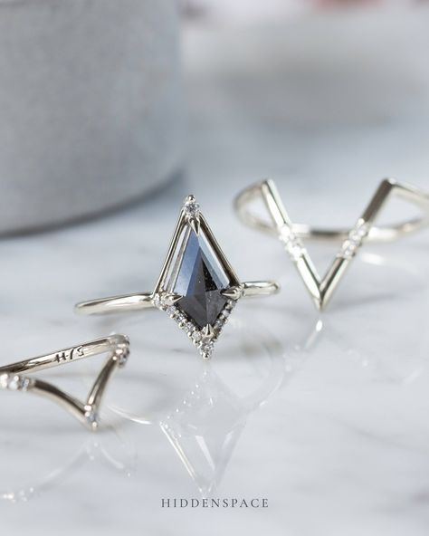 Stacked for a statement with kites all the way! Many of our wedding bands feature an architectural chevron design, perfectly crafted to complement and seamlessly stack with our unique kite-shaped engagement rings. #hiddenspace #finejewelry #kiteshapedring #saltandpepperdiamondring #artdeco #architecturaldesign #modernvintage #whitegoldring #platinumring #diamondalternative #handmadejewelry #stackingrings #weddingringset Kite Ring, Temptation Island, Engagement Ring Shapes, Diamond Alternatives, Chevron Design, Kites, Platinum Ring, Salt And Pepper Diamond, Rock Star