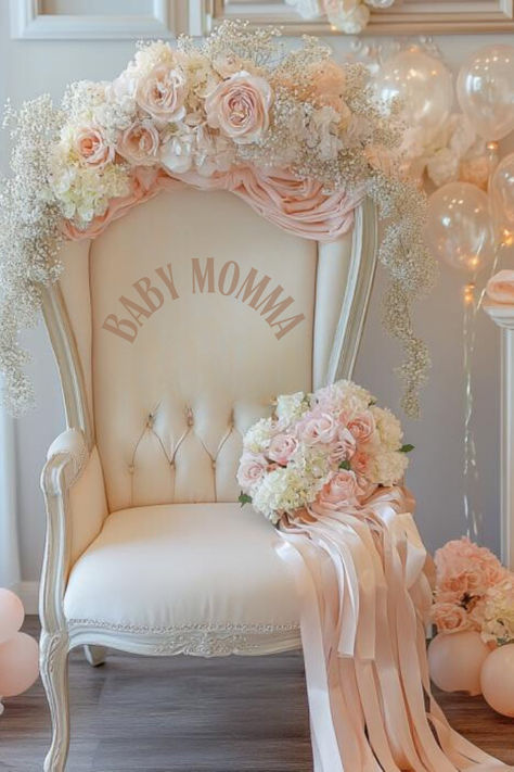 Baby shower chair with “Baby Momma” printed on the front inside, beautifully decorated with blush pink and white roses, baby's breath, and flowing ribbons. The chair is set against a backdrop of pastel balloons and soft florals, creating an elegant and luxurious feel for the mom-to-be’s special day. *We may earn a small commission from your purchase. Cream Baby Shower Decor, Baby Shower Chair For Mom, Princess Theme Baby Shower Ideas, Coquette Baby Shower Theme, Elegant Baby Shower Ideas, Vintage Baby Shower Ideas, Princess Baby Shower Ideas, Beige Balloons, Cream Balloons