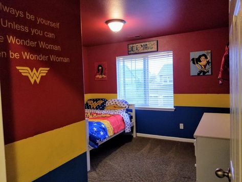 Red, yellow, and blue wonder woman, super hero Wonder Woman Bedroom Ideas, Wonder Woman Room Ideas, Superhero Princess Shared Room, Wonder Woman Classroom Theme, Wonder Woman Decor, Wonder Woman Door Decoration, Wonder Woman Room Decor, Comic Themed Room, Super Hero Room Decor