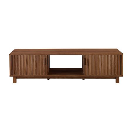 Whether you're into art-deco design, japandi interiors, or a modern motif, this is the tv stand you've been looking for. With its sleek and subtle hardware, reeded double doors, and fuss-free open storage cubby, your tech will be perfectly perched in style. Its low-profile leaves room for you to display your wall-mounted tv, decor, or wall art, yet it offers enough open and closed storage for all your entertainment center essentials. A warp resistant MDF wood build and stunning yet durable laminate finish lends form, function, and a fashionable aesthetic.Features: Quick Ship, Cable Management SystemJoinery: Dowel Joint, ScrewedNumber of Doors: 2Tools Required: Allen Wrench (included), Phillips Screwdriver (not Included)Maximum Screen Size: 65" MaxMeasurements: 16 Height/Inches, 58 Length/I Scandinavian Tv Stand, Reeded Door, Reeded Wood, Target Tv Stand, Mid Century Modern Tv Stand, Japandi Interiors, Storage Cubby, Wooden Tv Stands, Entertainment Stand