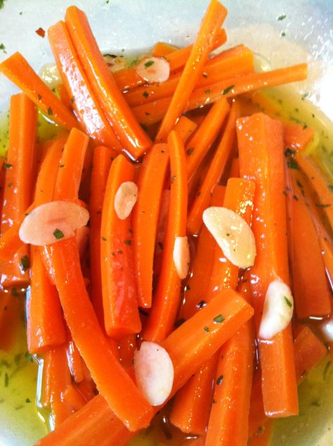 These carrots... oh man, these carrots! My grandmother would make them every year for Easter when I was growing up. I loved them so much when I was a kid that I included the "recipe" in a cookbook ... Marinated Carrots, Veggie Side Dish Recipes, Marinated Vegetables, My Bookshelf, Pickled Carrots, Potato Vegetable, Cooked Carrots, Carrot Recipes, Veggie Side Dishes