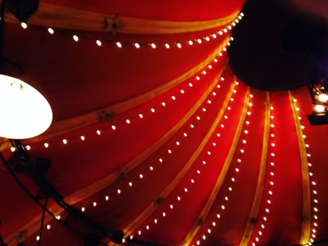 Festoon Lighting Red Circus Aesthetic, Bright Circus Aesthetic, Witchlight Carnival Aesthetic, Medieval Circus Aesthetic, Circus Lights Aesthetic, Travelling Circus Aesthetic, Circus Lights, Circus Aesthetic, Circus Wedding