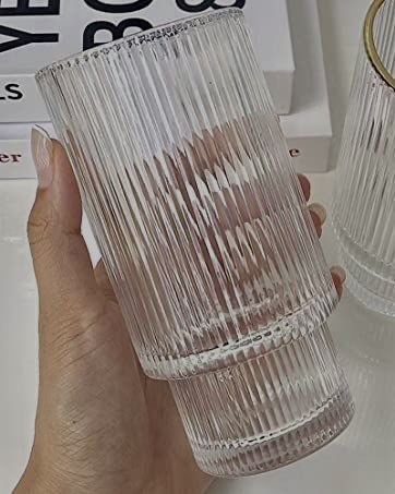 Someone holding a ribbed glass for cocktails or water. Kitchen Cups Glasses, Amazon Glass Cups, Cups Glass Drinks, Ribbed Glass Cups, Plastic Glasses Drinking, Ribbed Drinking Glasses, Trendy Glass Cups, Cute Drinking Glasses, Aesthetic Drinking Glasses