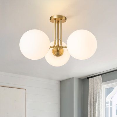 Simple and elegant, this minimalist globe ceiling light is excellent for a space with modern aesthetics and particularly pairs well with modern-style decor. Even with a simple design, it will be one of your eye-catching and timeless decor, perfect for your living room, bedroom, kitchen, bathroom, hallway, foyer, and laundry room. Fixture Finish: Gold, Shade Color: White | Mercer41 3-Light 22 Modern Sputnik Globe Semi Flush Mount in White / Yellow | 12.6 H x 22 W x 22 D in | Wayfair Mcm Lighting, Light Pants, Modern Style Decor, Globe Ceiling Light, Hallway Foyer, Bathroom Hallway, Timeless Decor, Kitchen Island Pendants, Drum Chandelier