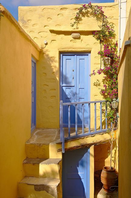 Yellow Building, Blue Doors, Interior Boho, Karpathos, Yellow Houses, Street House, Blue Door, Yellow Aesthetic, Beautiful Doors