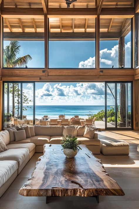 Interior of a beachfront home high ceiling full wall windows sliding doors with beach front tropical island views interior rustic style sectional. Discover what makes a dream beach house perfect for relaxation, fun, and seaside living. Modern Hawaiian House, Costa Rican Beach House, Rustic Beach House Interior, Hawaii Style Home, Hawaii Homes Interior, Brazil Beach House, Caribbean Homes Interiors, Airbnb Moodboard, Beach House California