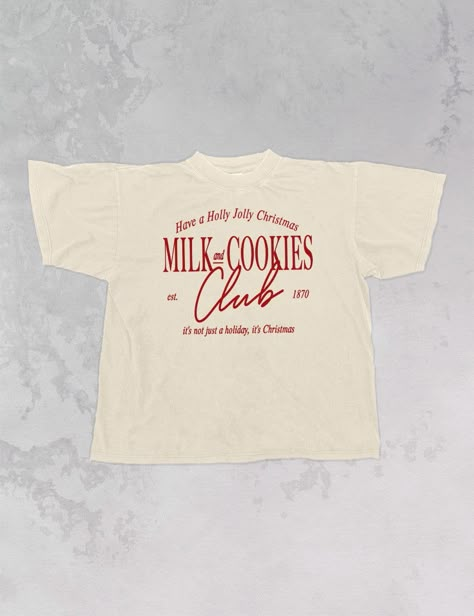 Join the Milk & Cookies club for everyone's favorite season, Christmas, in this super cozy oversized tshirt!- Features the phrase "Milk and Cookies Club, est. 1870" with "Have a Holly Jolly Christmas" above & "it's not just a holiday, it's Christmas" below all in red or white ink- Screen print transfer that is individually heat pressed onto each tshirt- Printed on a soft vintage wash tshirt, that gets softer with each wash- Oversized fit- 100% Cotton- Sizing translation: XS/S - L , S/M - XL , L/ Cool Christmas Tshirts, Italian T Shirts, Holiday Tshirt Designs, Staff Shirt Design, Fall T-shirt, Minimal Merch Design, Vintage Sports Tshirt, Christmas Graphic Tee, Christmas T-shirts