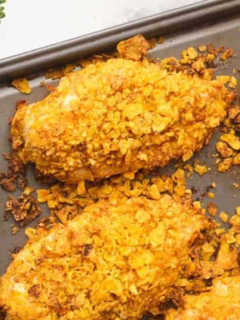 Doritos chicken has an incredibly crunchy coating and it is the perfect meal for picky eaters. This kid friendly family favorite meal is easy to make by coating chicken breasts with crushed Doritos and baking until crispy. Delicious with any flavor of Doritos, or even regular tortilla chips. Serve Dorito crusted chicken with your favorite sides and dipping sauces for an easy and complete meal. Click through to get this awesome dorito chicken recipe!! #doritochicken #doritos #easychickenrecipes Cereal Crusted Chicken, Corn Flake Crusted Chicken, Corn Flake Chicken Baked, Corn Flake Chicken Air Fryer, Corn Flake Fried Chicken, Corn Flake Chicken Tenders, Cereal Chicken, Corn Flake Chicken, Doritos Recipes