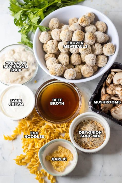 This easy slow cooker meatball stroganoff combines tender meatballs, cream of mushroom soup, sour cream, and a few other simple ingredients in a rich, creamy sauce served over egg noodles for all the classic flavors we love. Comfort food made easy in the crockpot! | www.persnicketyplates.com Meatballs With Cream Of Mushroom Soup Crock Pot, Meatball Mushroom Soup, Meatball Stroganoff Easy Mushroom Soup, Meatball Egg Noodle Recipes, Mushroom Meatballs Crockpot, Dump And Forget Crockpot Meals, Meatball Stroganoff With Cream Of Mushroom Soup, Mushroom Soup Meatballs Crockpot, Meatballs And Egg Noodles Easy