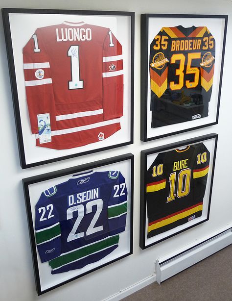 Display Hockey Jersey, Hanging Hockey Jerseys On Wall, Hockey Jersey Wall Display, Framed Sports Memorabilia, Jersey Wall Display Man Cave, Sports Memorabilia Display Ideas Framed Jersey, Sport Jersey Display Ideas, Hockey Jersey Frame, Hockey Jersey Display Ideas