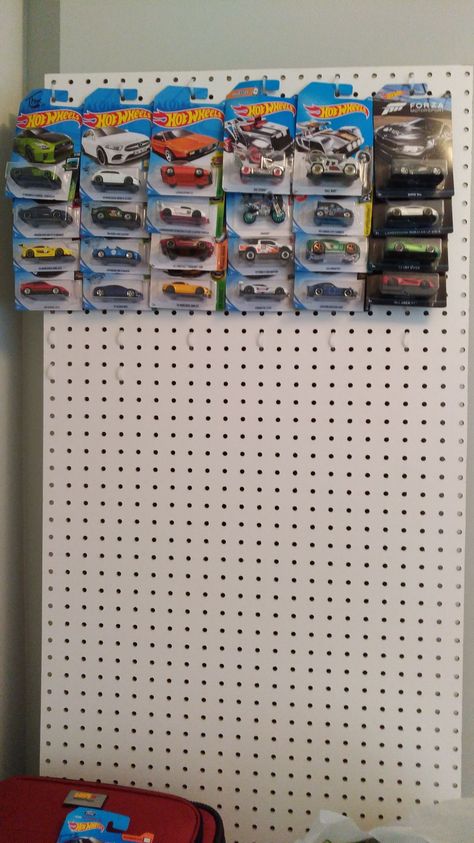 Creative and cheap DIY solution for a hot wheels display. Pegboard and dollar store zip ties. Expand as much as needed and hang anywhere you want. #hotwheels How To Display Hot Wheels, Hot Wheels Car Storage Ideas, Hot Wheels Display Diy, Hot Wheel Car Display Ideas Diy, How To Display Hot Wheels In Package, Hotwheel Display Idea, Hot Wheels Display In Package, Hot Wheel Organizer, Hot Wheels Organization Ideas