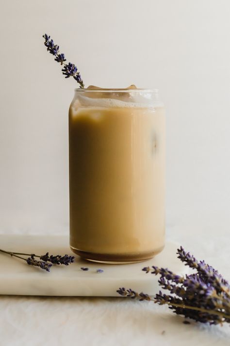 Tall glass filled with iced coffee with lavender sprig. Syrup Photography, Creamy Oat Milk, Copycat Drink Recipes, Copycat Starbucks Drinks, Baking Store, Lavender Syrup, Dairy Alternatives, Coffee Syrup, Food Drink Photography