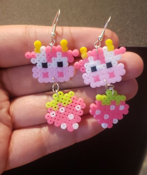 Cottagecore inspired, cute strawberry cow perler earrings! Absolutely darling and fun!  The second picture shows my larger ones to compare in size with. Cute Perler Bead Earrings, Earring Perler Beads, Pearled Bead Earrings, Easy Perler Bead Ideas Simple, Cute Perler Patterns, Kandi Perler Ideas, Fun Perler Bead Ideas, Pig Perler Beads, Cow Perler Beads