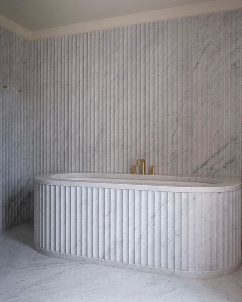 Gabriel Chipperfield on Instagram: “A recently completed bathroom in fluted Carrara stone” Carrara Bathroom, Fluted Marble, Apartment Bar, Marble Tub, White Marble Bathrooms, Stone Wall Cladding, Marble Price, Bathtub Tile, Indoor Tile